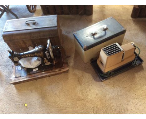 A Winselmann Titan sewing machine cased  AF; and a vintage slide projector