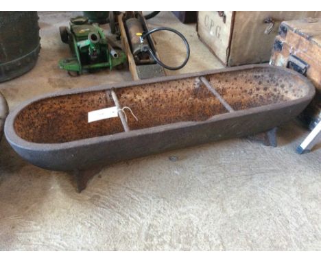 An old cast iron pig trough