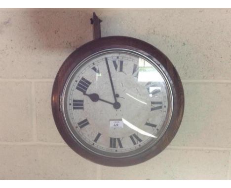 An oak cased 30 hour wall clock with Roman numeral dial