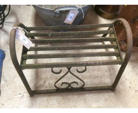 An ornate iron step