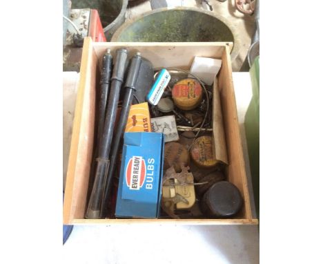 A box of miscellaneous cycling items to include vintage pumps, cycle light, Dunlop pump washers, brake cables etc.
