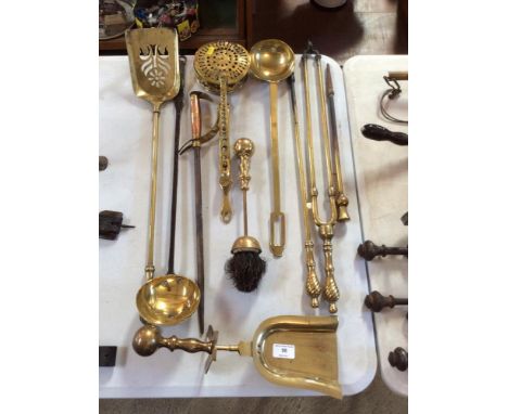 A brass chestnut roaster; a brass ladle; a brass and iron ladle; various fire implements etc.