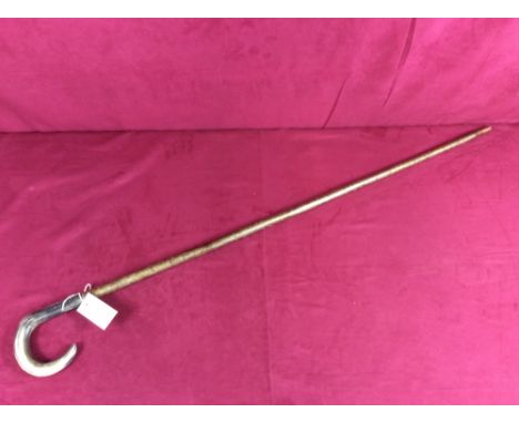 A walking stick with horn handle