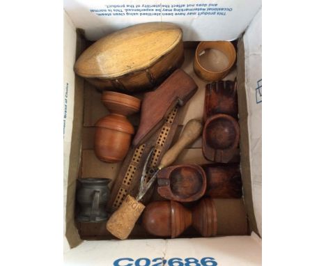 A collection of treen to include an inlaid cribbage board; a wooden butter box; shoe snuff box; a pewter pot bellied measure 