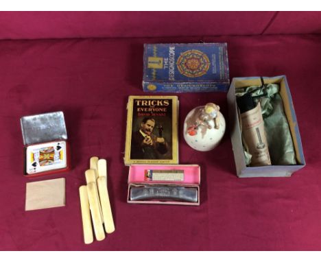 A cased Designoscope; Braille playing cards; various ephemera; a Hohner harmonica; a string dispenser etc.