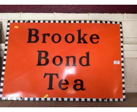An enamel sign for "Brook Bond Tea" 32cm x 76.5cm