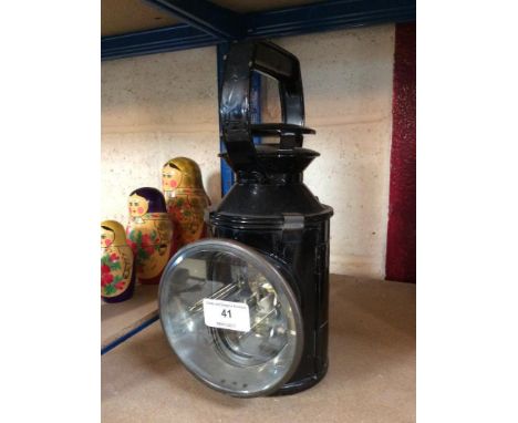 A vintage black painted railway lamp