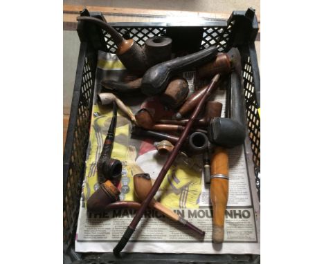 A collection of various vintage pipes, cigarette holders etc. 