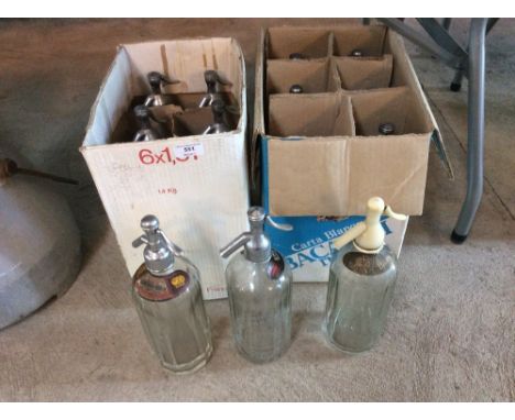 A collection of various vintage glass soda syphons