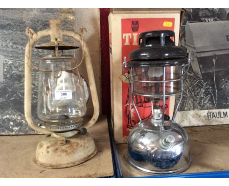 A vintage oil lamp and a pressurised Tilley lamp with original box