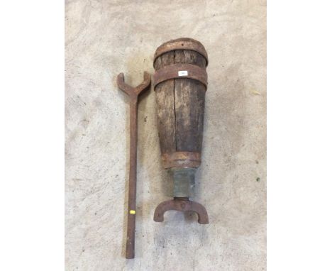 A large vintage wooden and iron mounted cart jack and spanner