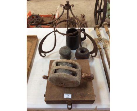 A vintage wooden fishing box; an old pulley; a wooden stable weight; iron light fitting; leather jack jug etc. 