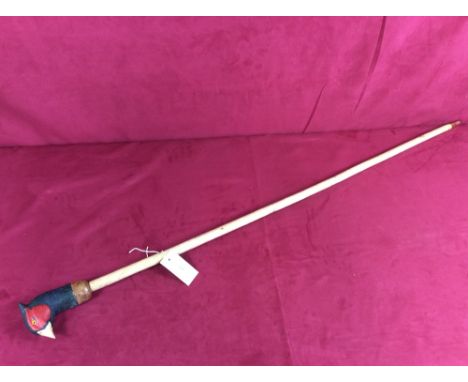 A walking stick with carved pheasant head handle