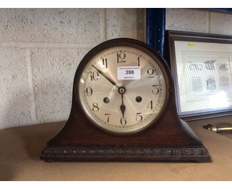 A 1930's oak cased chiming mantel clock