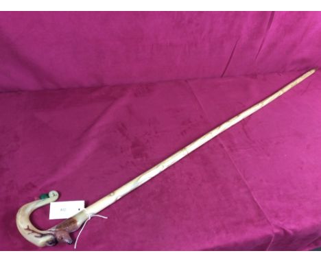 A walking stick with carved horn handle having stag and thistle decoration