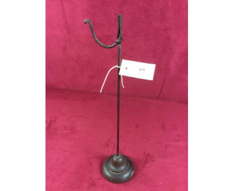 An antique rush light holder