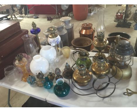 A collection of various oil lamps, and oil lamp parts