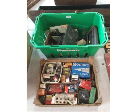 A collection various printing blocks; a vintage date stamp; and a box of numerous vintage glass light bulbs and accessories
