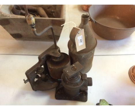 A 1954 Shelly clockwork fire jack; a phonograph spring driven motor; and a vintage oil can