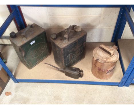 A vintage Aladdin paraffin can; two vintage petrol cans and an oil can