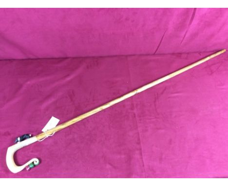 A walking stick, the horn handle with thistle and sheepdog decoration&nbsp;