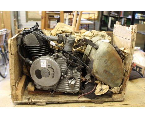 An unusual small Ducati Cucciolo petrol engine in remnants of original crate.