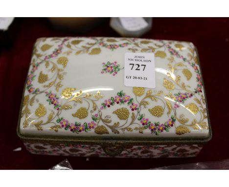 A French Limoges porcelain box and cover with enamel decoration.