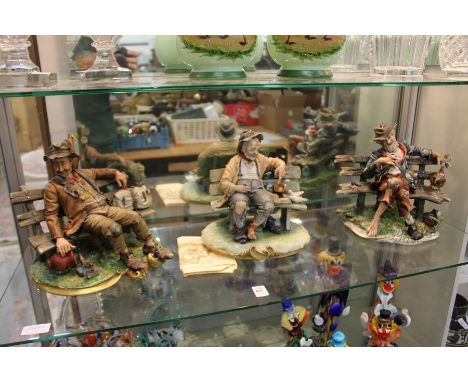 Three Capodimonte figures on tramps on benches.