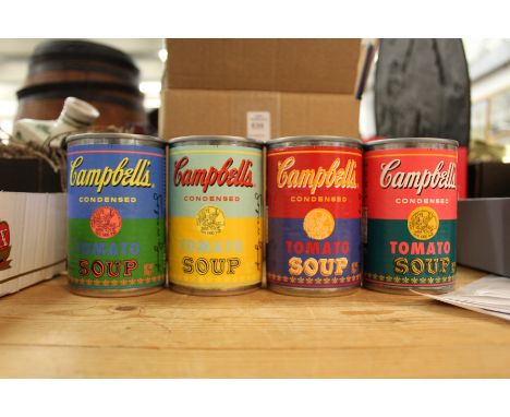 Four Andy Warhol tins of Campbell's condensed tomato soup.