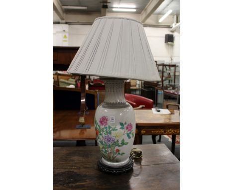 A Chinese floral decorated porcelain table lamp.