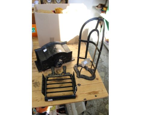 A cast iron boot jack / scraper together with a wrought iron saddle bracket and a cast iron rainwater hopper.