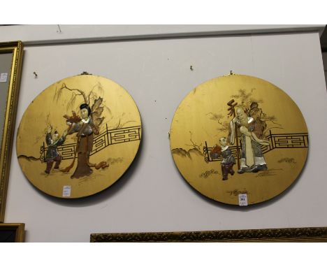 A set of four Chinese circular giltwood panels with hardstone inlaid decoration depicting figures.