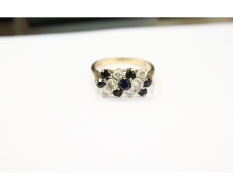 A 9ct gold, diamond and sapphire ring.