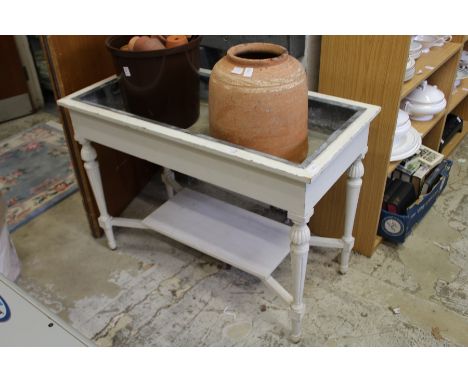 A white painted, zinc lined jardiniere / plant trough.