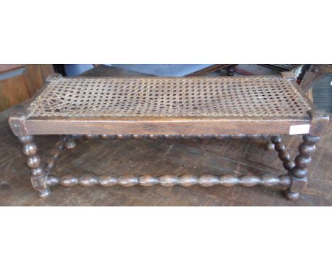 Footstool on bobbin turned legs and stretcher, cane seat A/F 