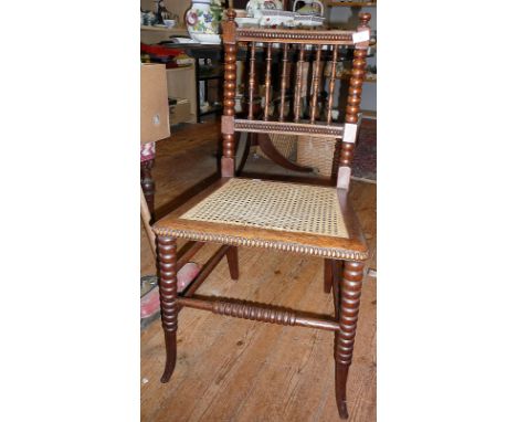 Victorian rosewood spindle back bedroom chair with bobbin turned uprights and legs having a cane seat