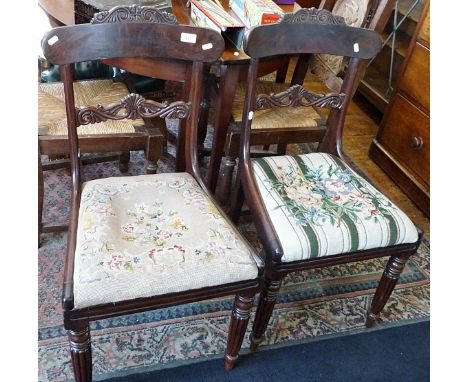 Pair of mid 19th c. mahogany dining chairs with carved top rail and bar having tapestry seats above turned fluted legs 