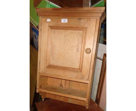 Stripped pine wall cupboard with shelf 