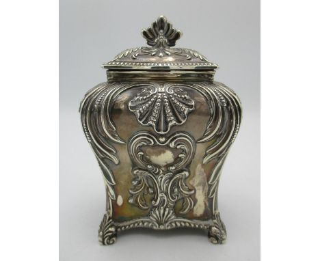 A Victorian silver tea caddy by Thomas Bradbury &amp; Sons, London 1894, of bombe form with repousse rocaille and c scroll de