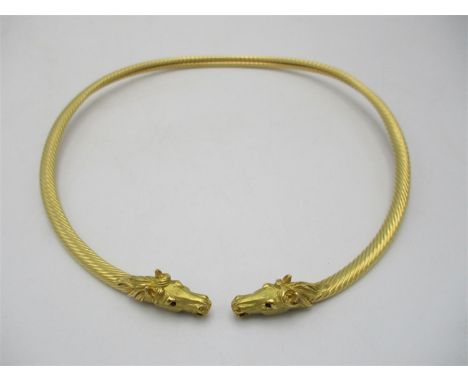 A Cartier style French gold double equestrian choker necklace, modelled with two horse heads inset with ruby eyes and rope tw