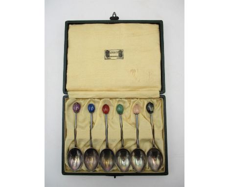 A cased set of six George V silver teaspoons by Liberty &amp; co, Birmingham 1926, each with hardstone finial (quartz, agate,