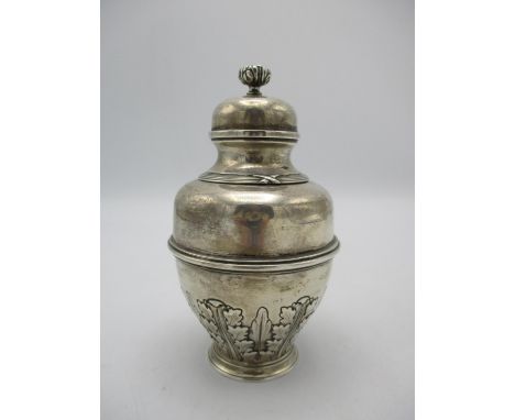 A George V silver tea caddy by Elkington, Birmingham 1910, designed in a lidded urn shape with acanthus leaves to the bottom,