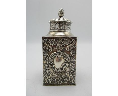 A Victorian silver tea caddy by William Comyns &amp; Sons, London 1897, of rectangular form with embossed cartouches to all f