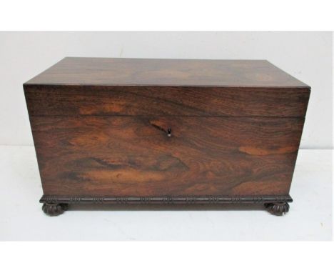 A Victorian rosewood tea caddy of rectangular form with cast bronze ring handles either side, opening to reveal a glass bowl 