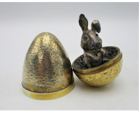 A Stuart Devlin novelty silver gilt surprise egg, London 1992, the inside revealing a model of a bunny rabbit, the underside 