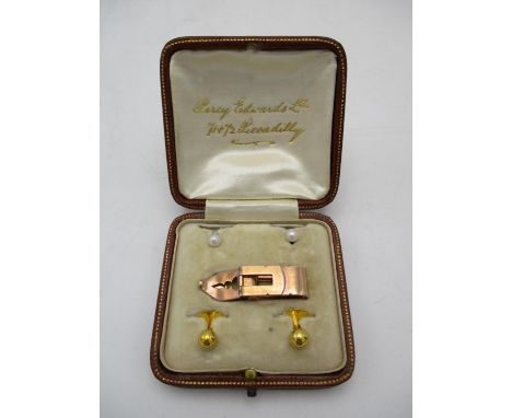 A cased pair of French 18ct gold studs with pearl, together with another pair of 18ct gold studs and a rose coloured metal ti