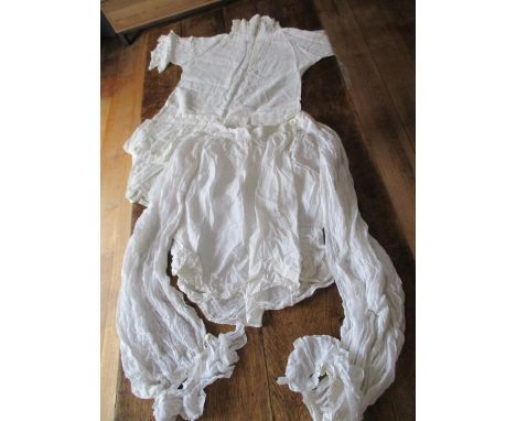 A group of 19th and 20th century ladies clothing to include a white cotton blouse with detachable ruffled cuffs, a girl's whi