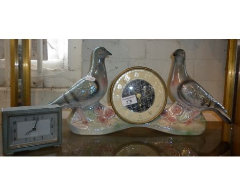 Kitsch lustre china mantle clock, the movement being flanked by two pigeons and another small Art Deco metal cased clock by E