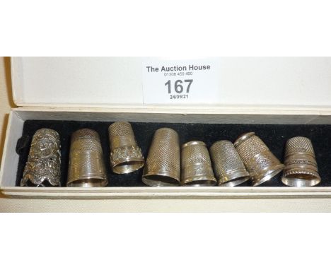 8 silver thimbles