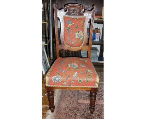 Pair of Edwardian carved oak dining chairs with tapestry style upholstery